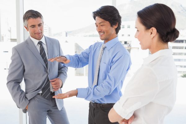 Happy employees having a discussion in the office