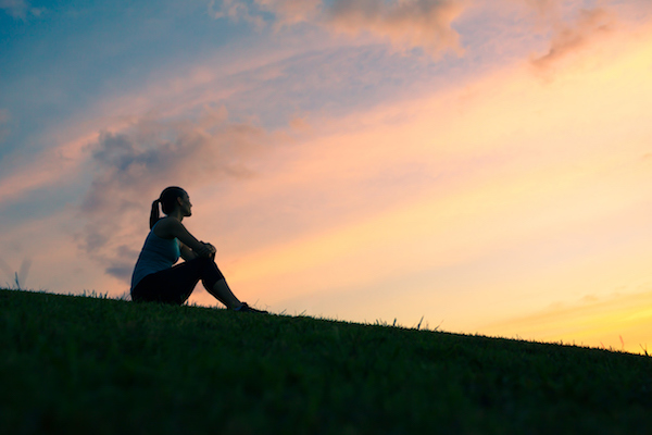 Woman watching sunset